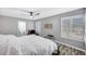 Bright main bedroom with wood-look floors, plantation shutters, and access to ensuite bath at 8316 Maplestar Rd, Las Vegas, NV 89128