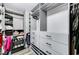 Well-organized walk-in closet with custom shelving and drawers for optimal storage at 8316 Maplestar Rd, Las Vegas, NV 89128