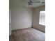 Bedroom with neutral walls and floors; a door and a window are also visible at 8324 W Charleston Blvd # 2033, Las Vegas, NV 89117