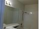 Bathroom with a large mirror, bright vanity lights, and a shower-tub combination at 8332 Shore Breeze Dr, Las Vegas, NV 89128