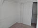 Bedroom with sliding closet doors and neutral color palette at 8332 Shore Breeze Dr, Las Vegas, NV 89128