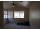 This is a spacious bedroom with high ceilings, windows, and a ceiling fan at 8332 Shore Breeze Dr, Las Vegas, NV 89128