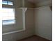 Bright bedroom with a large window and built-in shelving at 8332 Shore Breeze Dr, Las Vegas, NV 89128
