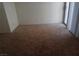 Bedroom with plush carpeting, natural light, and sliding glass doors at 8332 Shore Breeze Dr, Las Vegas, NV 89128