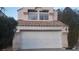 Charming home featuring a two-car garage and lush, mature landscaping at 8332 Shore Breeze Dr, Las Vegas, NV 89128