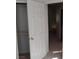Hallway featuring a view into a bedroom with ensuite bathroom at 8332 Shore Breeze Dr, Las Vegas, NV 89128
