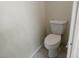 A well-maintained toilet sits against a clean, neutral-colored wall at 8332 Shore Breeze Dr, Las Vegas, NV 89128