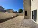Fenced backyard featuring a gravel area and a paved section, ideal for outdoor enjoyment at 8566 Bright Bush St, Las Vegas, NV 89131