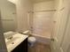 Bathroom featuring a single sink vanity, shower-tub combo, and tile floors at 8566 Bright Bush St, Las Vegas, NV 89131