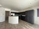 Kitchen with tile floors, dark wood cabinets, stainless steel appliances, and recessed lighting at 8566 Bright Bush St, Las Vegas, NV 89131