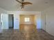 Spacious living room featuring tile floors, open layout, and natural lighting at 8566 Bright Bush St, Las Vegas, NV 89131