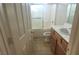 Standard bathroom with a tub/shower combo and light wood cabinetry at 8695 Canfield Canyon Ave, Las Vegas, NV 89178