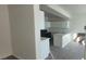 Kitchen with white cabinets, black gas range, and bright countertops at 8695 Canfield Canyon Ave, Las Vegas, NV 89178
