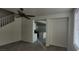 Open-concept living space with views to the kitchen at 8695 Canfield Canyon Ave, Las Vegas, NV 89178