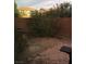 Enclosed backyard with brick wall, patio, and desert landscaping at 8749 Brilliant Star Dr, Las Vegas, NV 89178