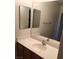 Bathroom vanity with sink and mirror at 8749 Brilliant Star Dr, Las Vegas, NV 89178