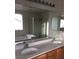 Bathroom featuring double sinks, large mirror, separate bathtub and walk-in shower at 8749 Brilliant Star Dr, Las Vegas, NV 89178
