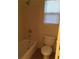 Standard bathroom setup including bathtub, toilet and window at 8749 Brilliant Star Dr, Las Vegas, NV 89178