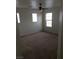 A neutral-toned bedroom features natural light, a ceiling fan, and spacious design at 8749 Brilliant Star Dr, Las Vegas, NV 89178