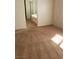Bright bedroom featuring fresh carpeting, neutral paint, and view of the adjacent bathroom at 8749 Brilliant Star Dr, Las Vegas, NV 89178