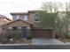 Two-story home with stone accents and attached garage at 8749 Brilliant Star Dr, Las Vegas, NV 89178