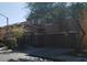 Two-story home featuring an attached garage, well-kept lawn, and welcoming curb appeal at 8749 Brilliant Star Dr, Las Vegas, NV 89178