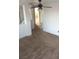 Hallway provides access to various rooms, enhanced by a ceiling fan for air circulation at 8749 Brilliant Star Dr, Las Vegas, NV 89178