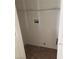 Convenient laundry room features tile flooring and a wire shelf for organizing supplies at 8749 Brilliant Star Dr, Las Vegas, NV 89178