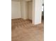 Neutral living room with a carpeted floor and an open doorway to another room, with light-colored walls at 8749 Brilliant Star Dr, Las Vegas, NV 89178