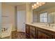 Bathroom featuring double sinks, bath tub and walk-in shower at 9120 Parkstone Ave, Las Vegas, NV 89178