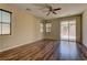 Bright bedroom with wood-look floors, fan and natural light at 9120 Parkstone Ave, Las Vegas, NV 89178