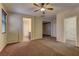 Spacious bedroom featuring carpet floors and walk-in closet access at 9120 Parkstone Ave, Las Vegas, NV 89178