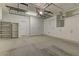 Garage with storage cabinets, ceiling rack and epoxy floor at 9120 Parkstone Ave, Las Vegas, NV 89178