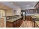 Gourmet kitchen with stainless steel appliances and a convenient breakfast bar at 9120 Parkstone Ave, Las Vegas, NV 89178