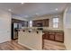 Modern kitchen featuring stainless steel appliances, dark wood cabinetry and granite countertops at 9120 Parkstone Ave, Las Vegas, NV 89178