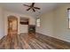 Open floor plan with hardwood floors, fireplace and kitchen view at 9120 Parkstone Ave, Las Vegas, NV 89178