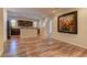 Open living space with hardwood floors, seamless flow to kitchen, and neutral tones at 9120 Parkstone Ave, Las Vegas, NV 89178