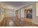 Open-concept living area featuring hardwood floors, neutral paint, and a chandelier at 9120 Parkstone Ave, Las Vegas, NV 89178