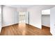 Bright bedroom featuring hardwood floors, neutral walls, and access to a closet at 9609 Rolling Thunder Ave, Las Vegas, NV 89148