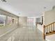 Open-concept living room featuring tile floors, recessed lighting, and multiple windows for ample natural light at 9609 Rolling Thunder Ave, Las Vegas, NV 89148