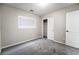 Small carpeted bedroom features a closet with sliding doors and a window at 9750 Maple Sugar Leaf Pl, Las Vegas, NV 89148