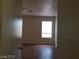 Cozy bedroom with light walls, wood floors, and a bright window at 9937 La Paca Ave, Las Vegas, NV 89117
