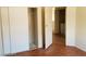 View of a bedroom with a closet and a doorway leading to a laundry area at 9937 La Paca Ave, Las Vegas, NV 89117