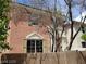 Two-story house showcasing a front entrance, tree, and textured wall at 9937 La Paca Ave, Las Vegas, NV 89117