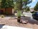 Landscaped front yard with desert plants and decorative rock, close to the street in a quiet neighborhood at 9937 La Paca Ave, Las Vegas, NV 89117