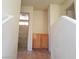 Hallway featuring a small cabinet, leading to the adjacent bathroom and bedrooms at 9937 La Paca Ave, Las Vegas, NV 89117