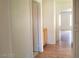 Hallway featuring a small cabinet, leading to the adjacent bathroom and bedrooms at 9937 La Paca Ave, Las Vegas, NV 89117