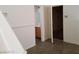 Upstairs shot toward bathroom and bonus area with light interior paint and tile flooring at 9937 La Paca Ave, Las Vegas, NV 89117