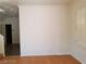 An open area features light interior paint, plank flooring, and plantation shutters at 9937 La Paca Ave, Las Vegas, NV 89117