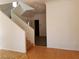 Staircase leads to the upper level with wood steps and a crisp, white railing at 9937 La Paca Ave, Las Vegas, NV 89117